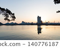 The port and silos of the Takasago Industrial Zone, bathed in the setting sun (Takasago City, Hyogo Prefecture) 140776187
