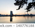 The port and silos of the Takasago Industrial Zone, bathed in the setting sun (Takasago City, Hyogo Prefecture) 140776188