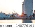 The port and silos of the Takasago Industrial Zone, bathed in the setting sun (Takasago City, Hyogo Prefecture) 140776191
