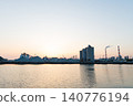 The port and silos of the Takasago Industrial Zone, bathed in the setting sun (Takasago City, Hyogo Prefecture) 140776194