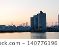 The port and silos of the Takasago Industrial Zone, bathed in the setting sun (Takasago City, Hyogo Prefecture) 140776196