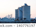 The port and silos of the Takasago Industrial Zone, bathed in the setting sun (Takasago City, Hyogo Prefecture) 140776197