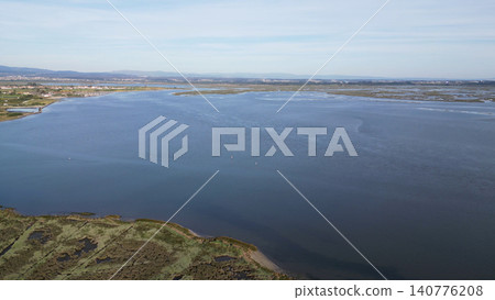 Aerial view of the tranquil Aveiro Lagoon waters near Cais da Ribeira de Pardelhas in Murtosa Aerial view of the tranquil Aveiro Lagoon waters near Cais da Ribeira de Pardelhas in Murtosa 140776208