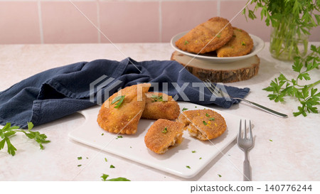 Golden fried savory empanadas garnished with fresh parsley 140776244