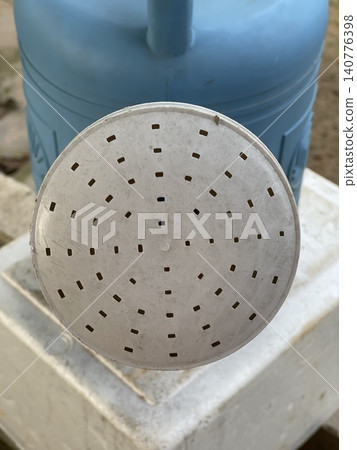Close Up Of Plastic Watering Can Spout With Perforated Round Head 140776398