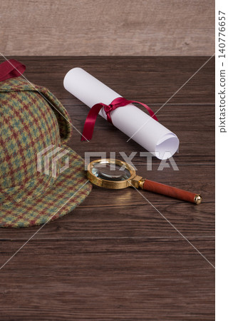 Wrapped paper sheets and magnifying glass Wrapped paper sheets and magnifying glass 140776657