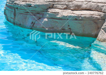 A natural sandstone border surrounds the hotel's serene swimming pool A natural sandstone border surrounds the hotel's serene swimming pool 140776762
