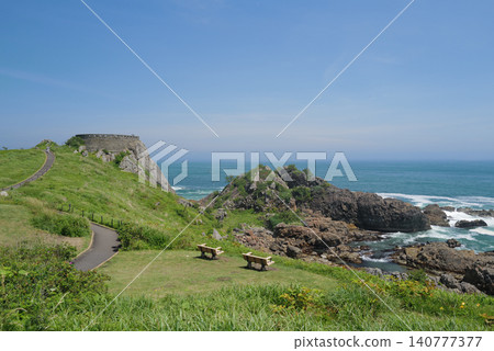 The dynamic scenery of Ashigezaki Observatory on the Sanriku Coast, overlooking the beautiful Pacific Ocean and a cape blooming with Japanese roses. The dynamic scenery of Ashigezaki Observatory on the Sanriku Coast, overlooking the beautiful Pacific Ocean and a cape blooming with Japanese roses. 140777377