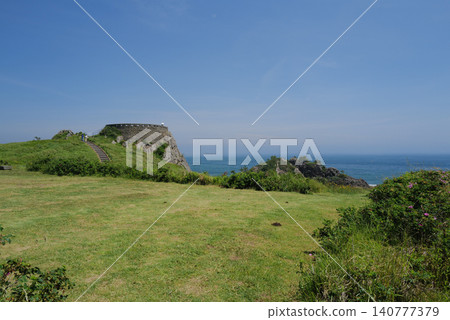Ashigezaki Observatory, a scenic spot in Hachinohe City, stands amidst a clear blue sky and vast green lawns. Ashigezaki Observatory, a scenic spot in Hachinohe City, stands amidst a clear blue sky and vast green lawns. 140777379