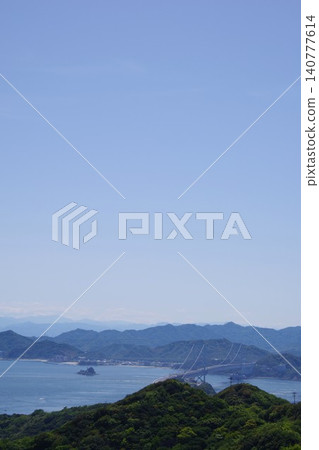 View towards the Great Naruto Bridge from Uzunooka Hill in Minamiawaji City, Hyogo Prefecture. 140777614