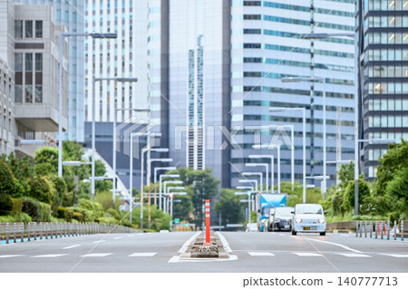 Pedestrian crossings on roads in the business and office districts of Tokyo, Japan, where skyscrapers line the streets. Pedestrian crossings on roads in the business and office districts of Tokyo, Japan, where skyscrapers line the streets. 140777713