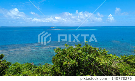 A refreshing background image featuring an endless blue ocean and vibrant green scenery, complete with copy space. A refreshing background image featuring an endless blue ocean and vibrant green scenery, complete with copy space. 140778276