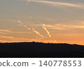 Clouds resembling a dragon shining in the setting sun! Auspicious dragon clouds that bring good fortune and wealth. Perfect as wallpaper or background material for good luck and spirituality. 140778553