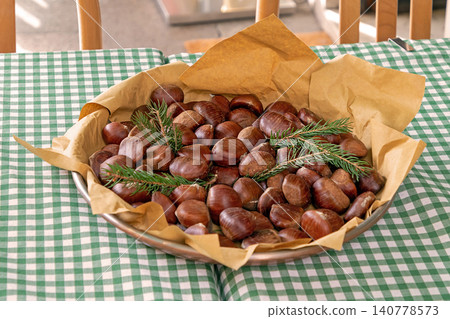 Roasted chestnuts in bowl 140778573