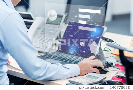 An image of a businessman using a computer in an office, with a digital UI panel floating in the background. An image of a businessman using a computer in an office, with a digital UI panel floating in the background. 140778658
