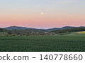 A mystical pink sky illuminated by a full moon. Perfect for backgrounds, wallpapers, and web materials for purification, healing, and spiritual good fortune. 140778660