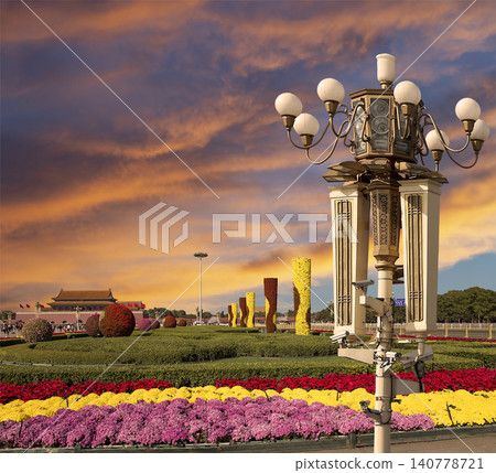 Street lamp on Tiananmen Square in Beijing, China (against the sunset), with propaganda or public announcement speakers Street lamp on Tiananmen Square in Beijing, China (against the sunset), with propaganda or public announcement speakers 140778721