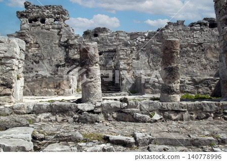 Ancient maya ruins and stone columns in tulum archaeological zone Ancient maya ruins and stone columns in tulum archaeological zone 140778996