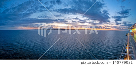 Sunset over calm sea from a cruise ship Sunset over calm sea from a cruise ship 140779081