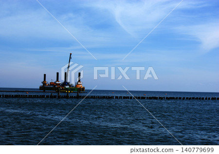 Polish Baltic Sea beautiful blue sea waves sand and beach drilling platform oil rig Polish Baltic Sea beautiful blue sea waves sand and beach drilling platform oil rig 140779699