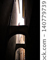 alley in the old town in Warsaw, gate between tenement houses 140779739