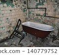 old dilapidated bathroom bathtub and chair 140779752