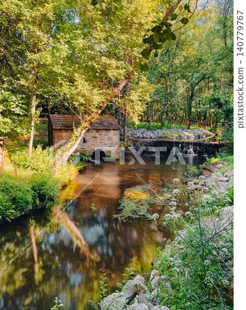 Scenic Stone Water Mill by a Peaceful Forest Stream Scenic Stone Water Mill by a Peaceful Forest Stream 140779767