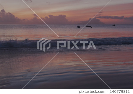 Tropical sunset showcasing vivid red and orange hues Tropical sunset showcasing vivid red and orange hues 140779811