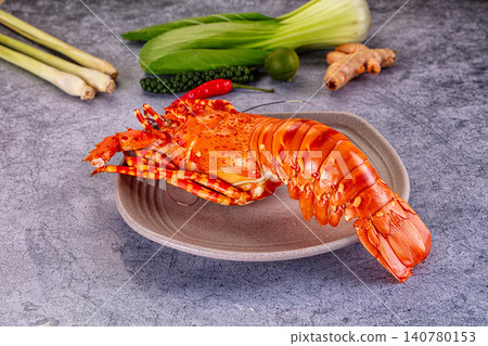 Cooked lobster on plate with fresh ingredients Cooked lobster on plate with fresh ingredients 140780153