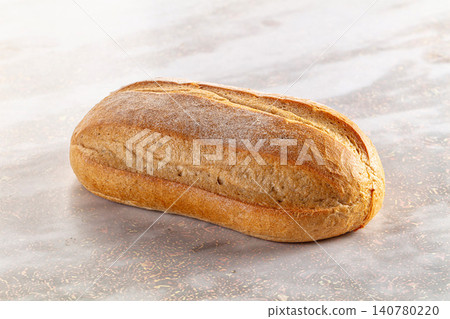 Freshly baked artisan bread loaf on marble surface Freshly baked artisan bread loaf on marble surface 140780220