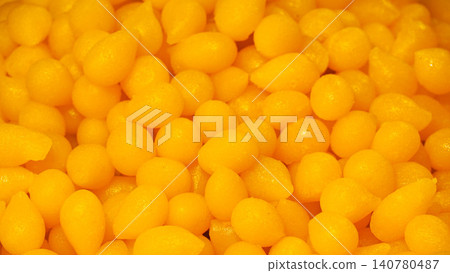 Close-up of Thong Yod, traditional Thai dessert golden egg yolk drops texture background. 140780487