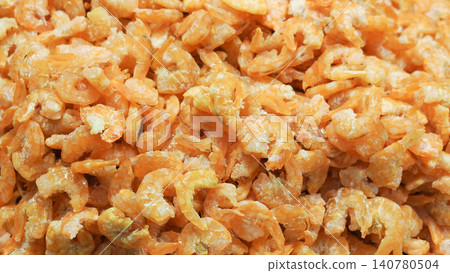 Close-up of dried shrimps pile, full frame background of orange dried prawns texture. Close-up of dried shrimps pile, full frame background of orange dried prawns texture. 140780504