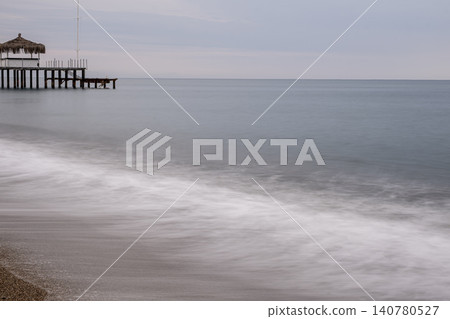 Vintage Beach Pier Extending into the Sea. Vintage Beach Pier Extending into the Sea. 140780527