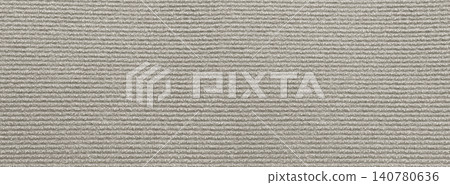 Beige corduroy fabric showing a textile ribbed pattern Beige corduroy fabric showing a textile ribbed pattern 140780636
