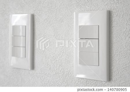 Close-up of a white wall and switch Close-up of a white wall and switch 140780905