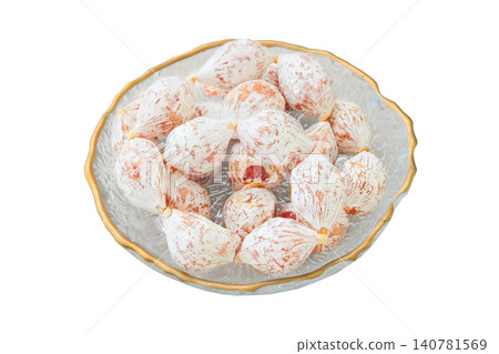 Fuet Mini in plate. Top view. Raw cured Spanish sausage on a white background. Gourmet snack. Fuet Mini in plate. Top view. Raw cured Spanish sausage on a white background. Gourmet snack. 140781569