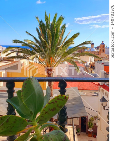 Scenic balcony view over the historic old town of Alicante with palm tree and sea background Scenic balcony view over the historic old town of Alicante with palm tree and sea background 140781976