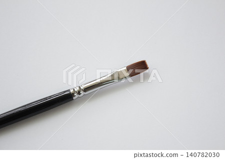 Acrylic brush on a white background. Acrylic brush on a white background. 140782030