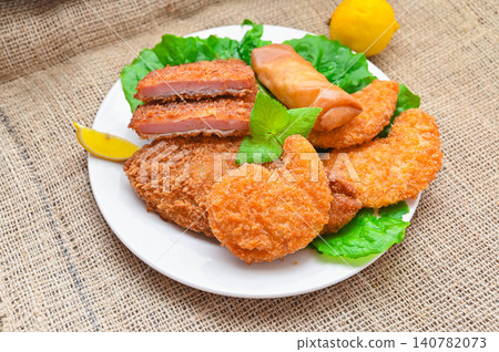 A generously portioned assortment of fried foods A generously portioned assortment of fried foods 140782073