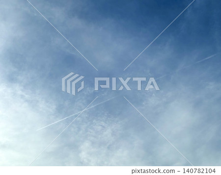 Contrails and thin clouds in the sky Contrails and thin clouds in the sky 140782104