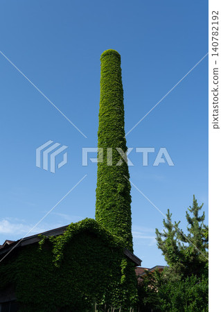 Akita City, Akita Prefecture: A chimney covered in vines Akita City, Akita Prefecture: A chimney covered in vines 140782192