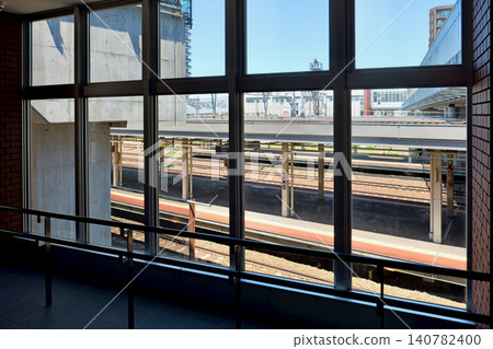A view of the station platform through a window inside JR Naebo Station. 140782400