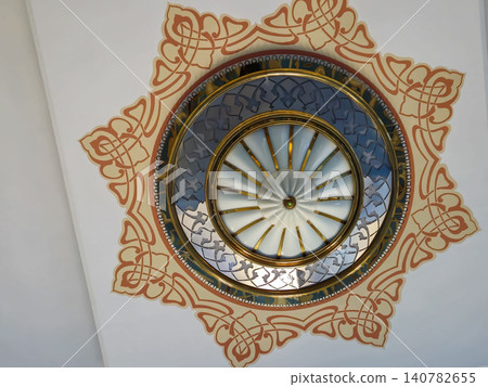 Decorative ceiling medallion with ornate circular design Decorative ceiling medallion with ornate circular design 140782655
