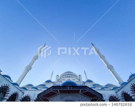 Grand mosque architecture under clear blue sky Grand mosque architecture under clear blue sky 140782658