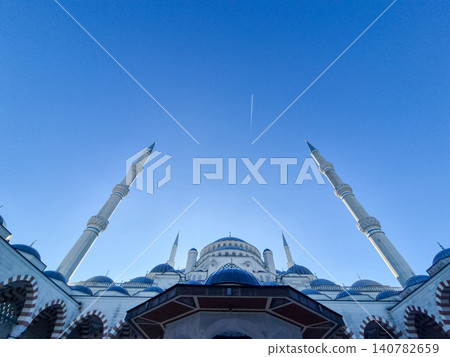 Blue mosque dome and minarets against clear sky 140782659