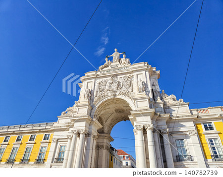 Historic triumphal arch against clear blue sky 140782739
