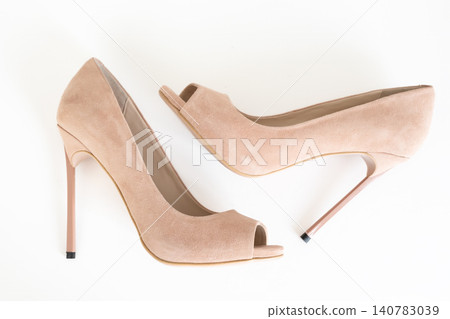 Nude peep toe high heel pumps isolated on white background 140783039