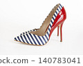 Striped high heel pump with red patent leather heel on white 140783041