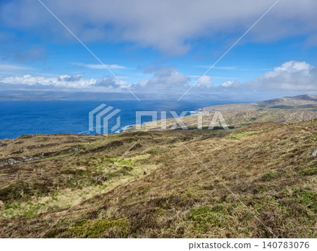 Scenic coastal landscape with ocean and rolling hills Scenic coastal landscape with ocean and rolling hills 140783076