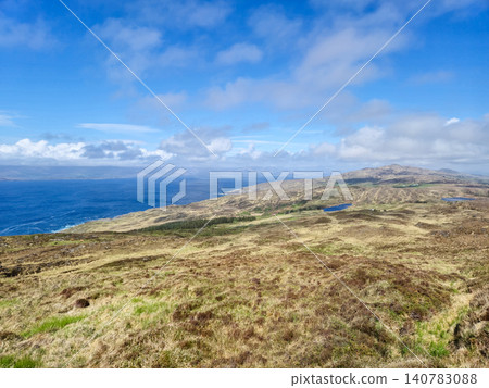 Scenic coastal landscape with hills and blue sky Scenic coastal landscape with hills and blue sky 140783088